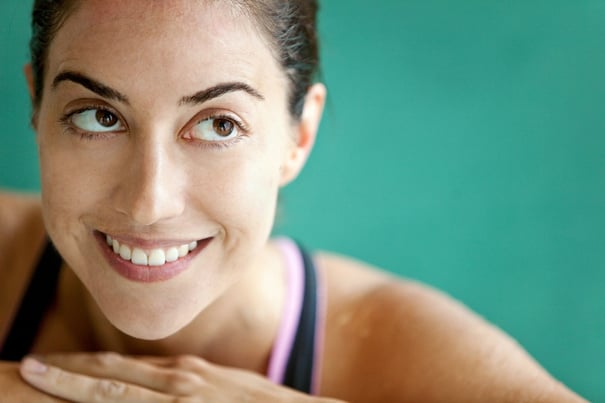 Portrait of a thoughtful female swimmer smiling.jpeg