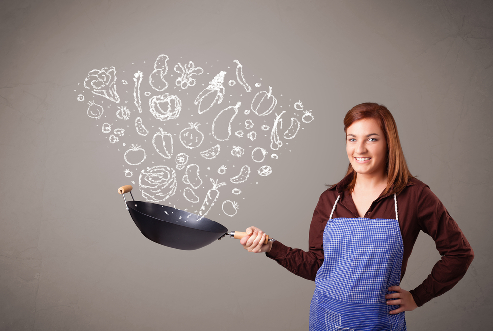 Pretty lady cooking vegetables